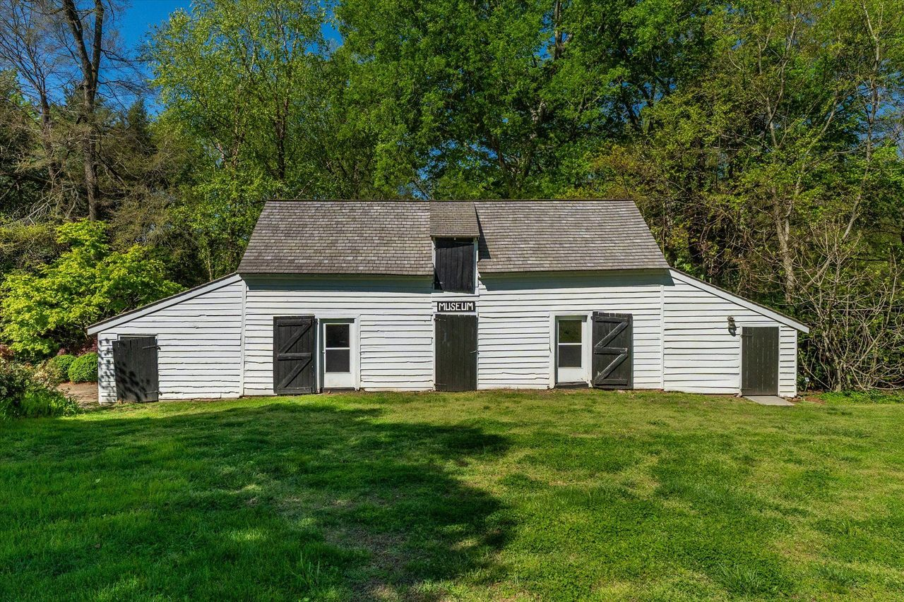 Continuing across the grounds, the barn has been repurposed as a museum.