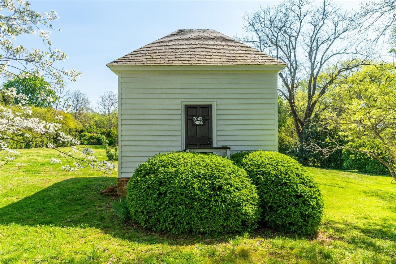 Tucked into a corner of the estate is the original one-room schoolhouse.