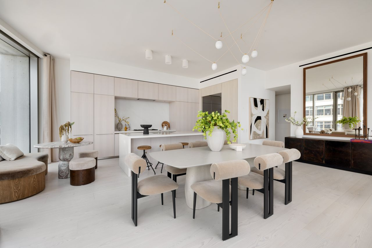 The dining area flows into a sleek Bulthaup kitchen.