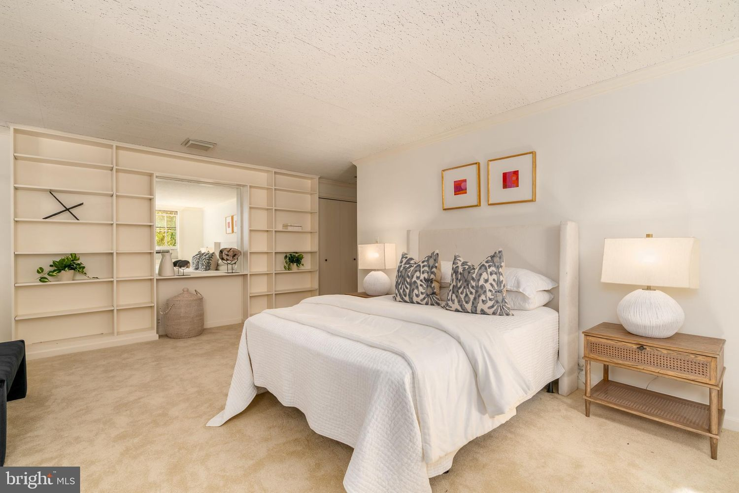 A third bedroom has a completely different layout, trading hardwood floors for plush carpeting and built-in shelving that stretches across one wall.