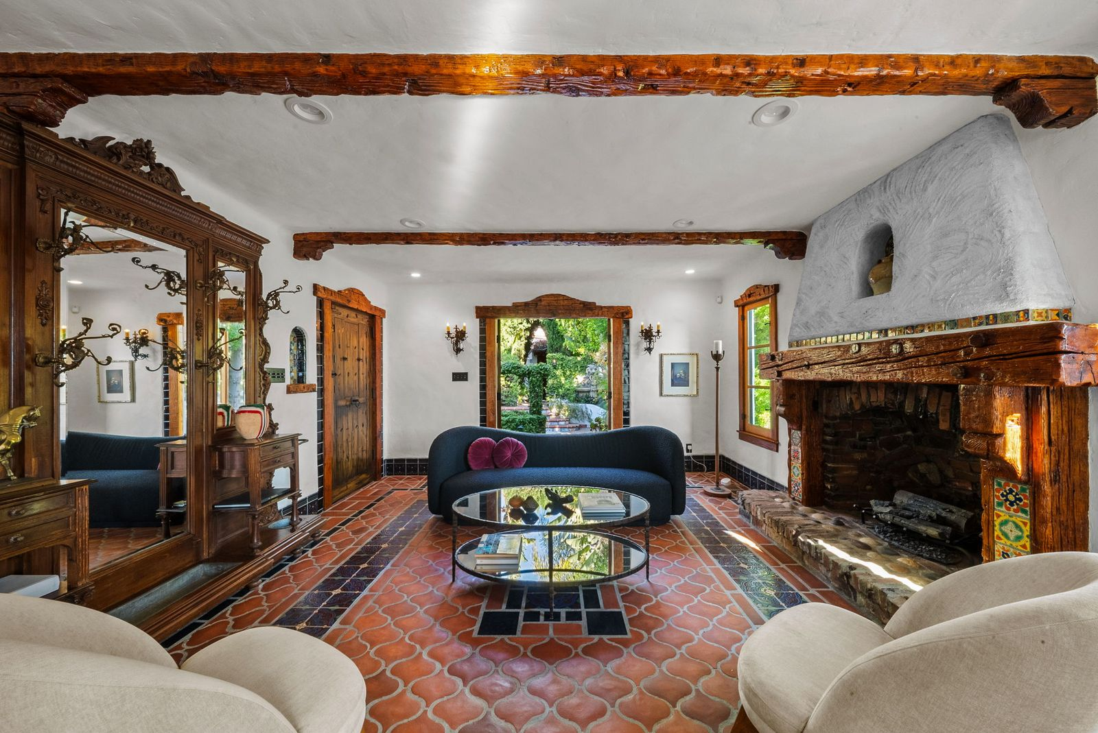 Saltillo tile floors are bordered by colorful Moroccan tile inlays.