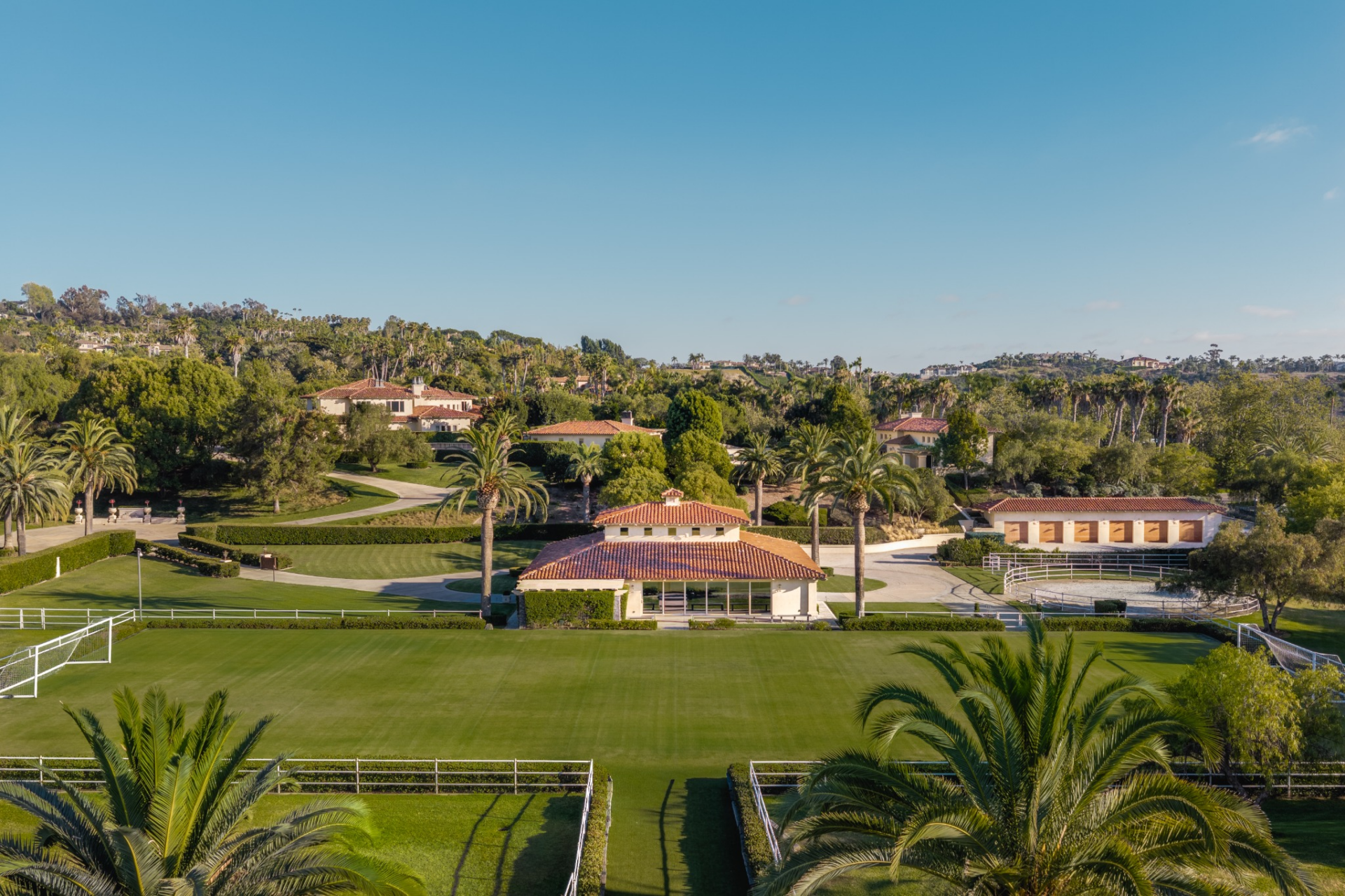 Farther across the property, a professional-level field is set up for both football and soccer, with goals set at opposite ends of the turf. 