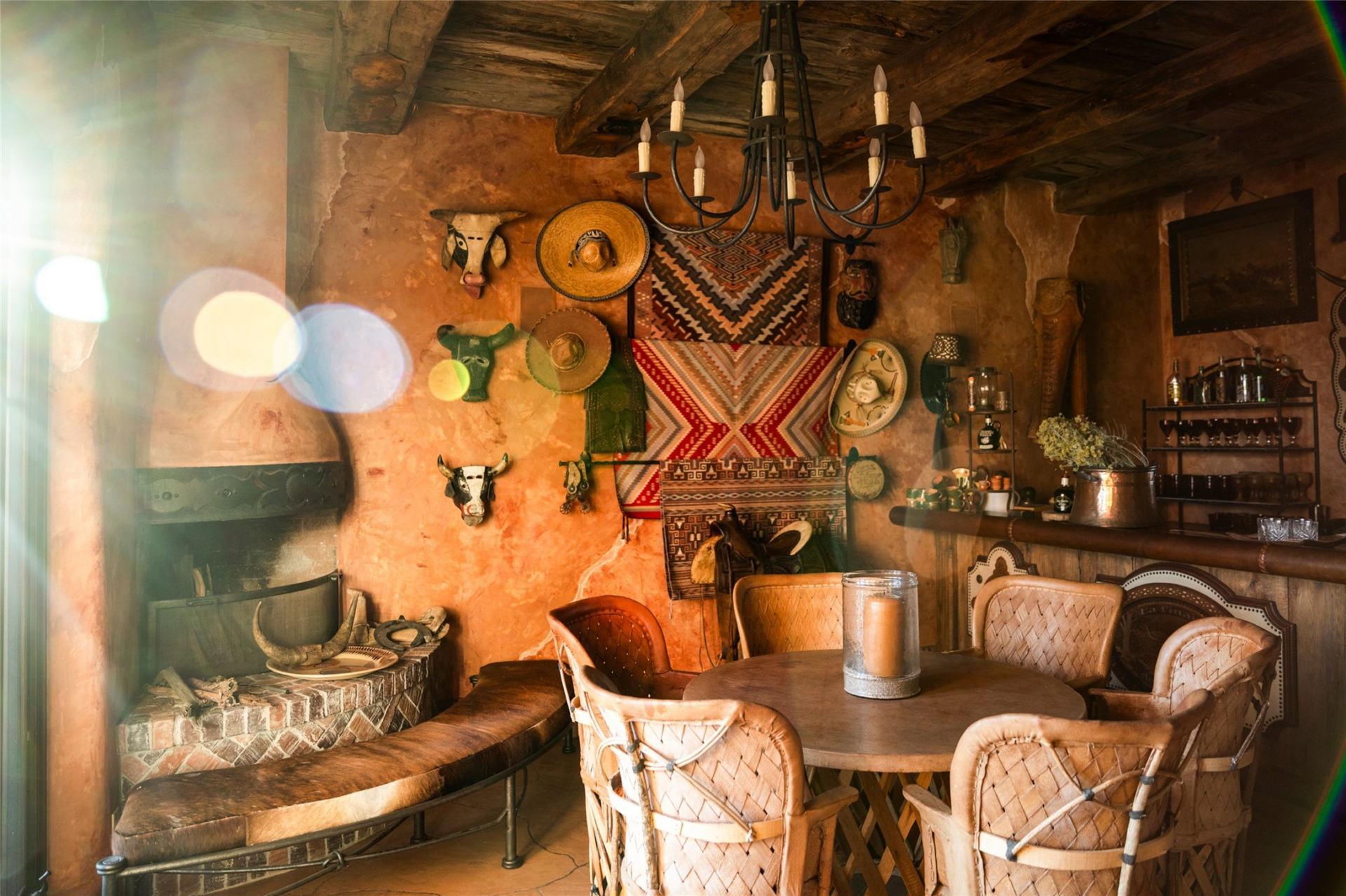 The cantina which was modeled after a traditional cowboy saloon, with warm plaster walls, exposed beams, iron railings, and period-inspired furniture. 