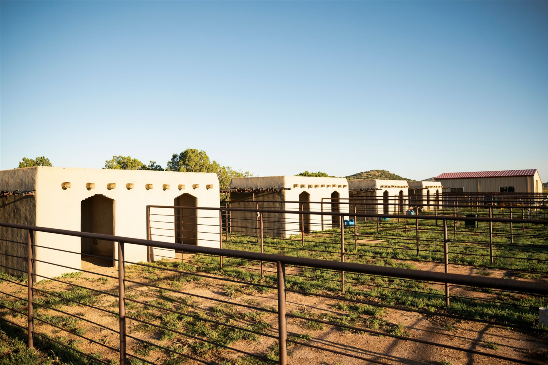 Twelve Pueblo-style horse stalls.