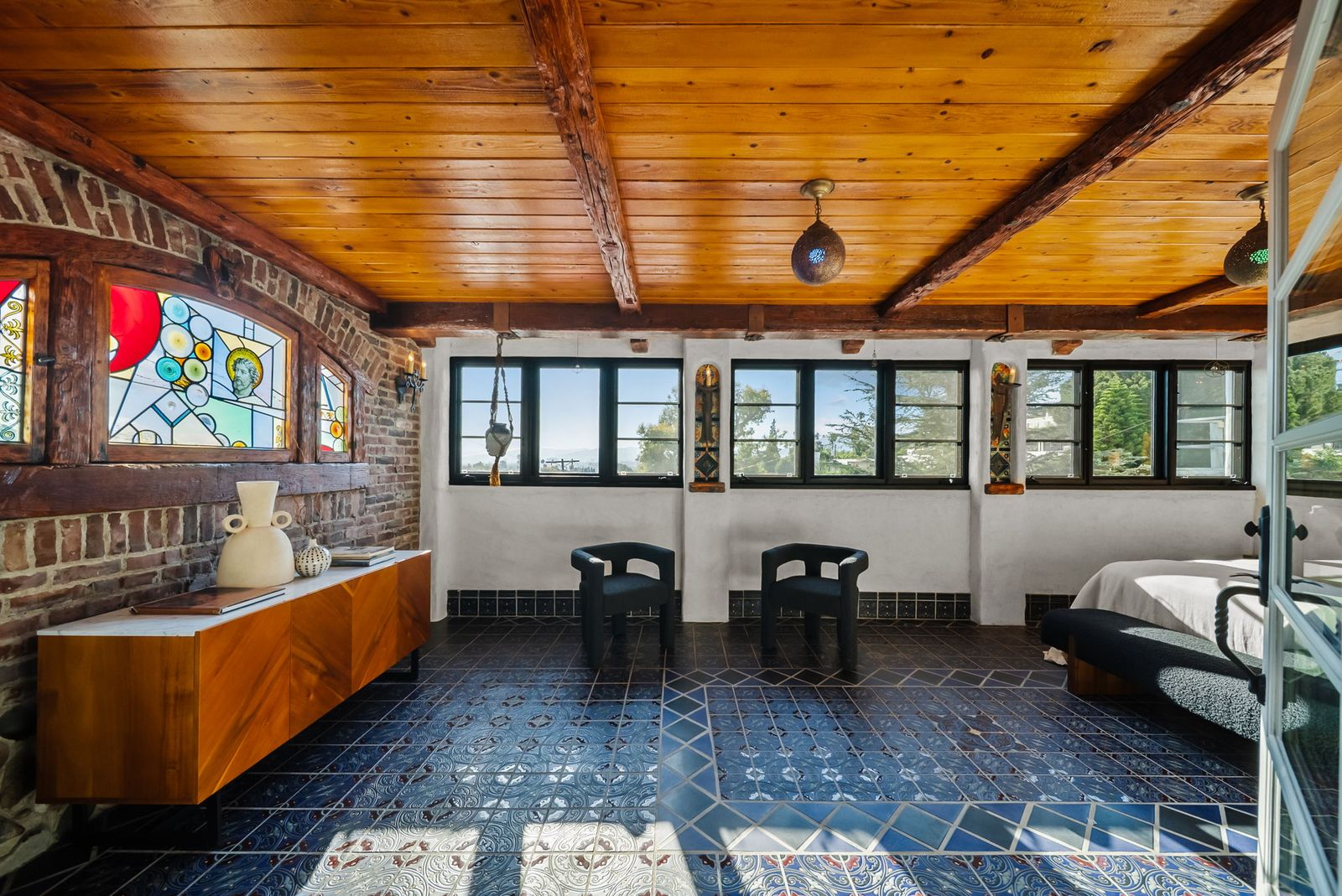 Custom stained-glass window to the left.