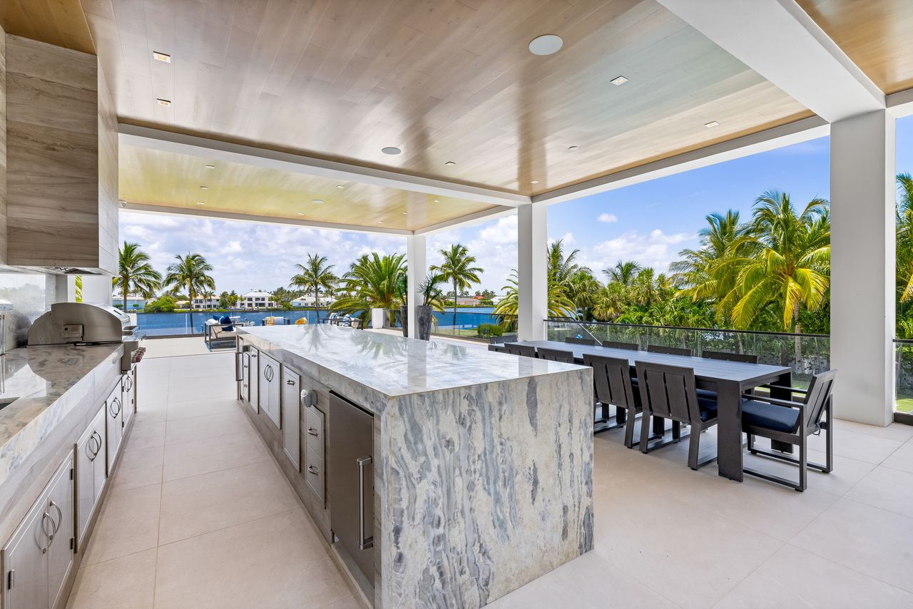 Built-in grilling appliances, refrigeration, a sink, and generous prep space make it perfect for family meals.