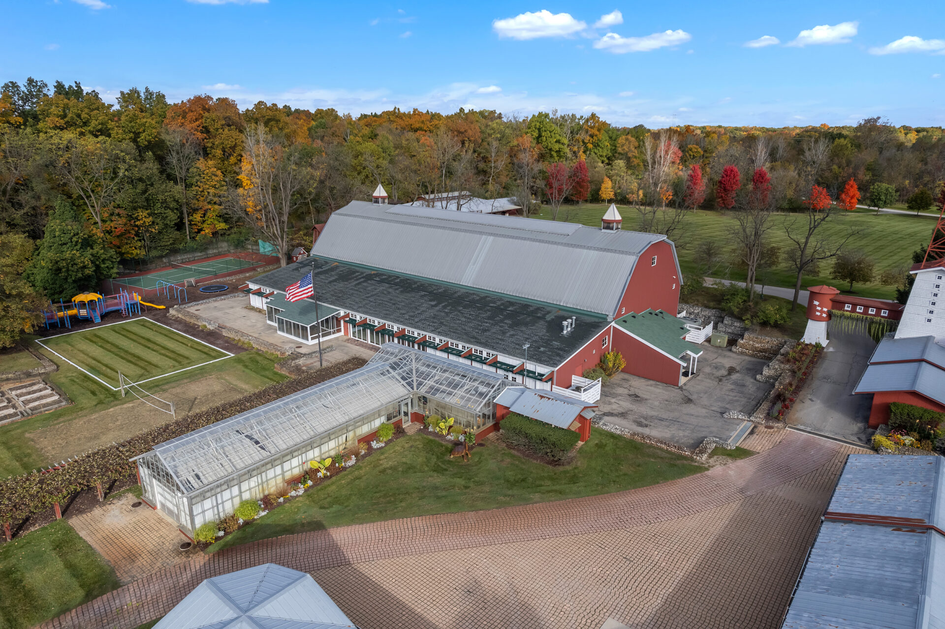 34,191-square-foot recreation building surrounded by a greenhouse, kid's park, and a tennis court.