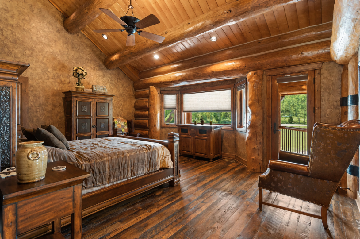 Inside the room includes a double-sized bed, multiple cabinets, and balcony access.