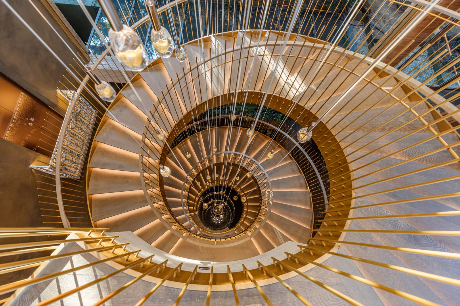 Overhead view of the four-story bronze-finished spiral staircase.