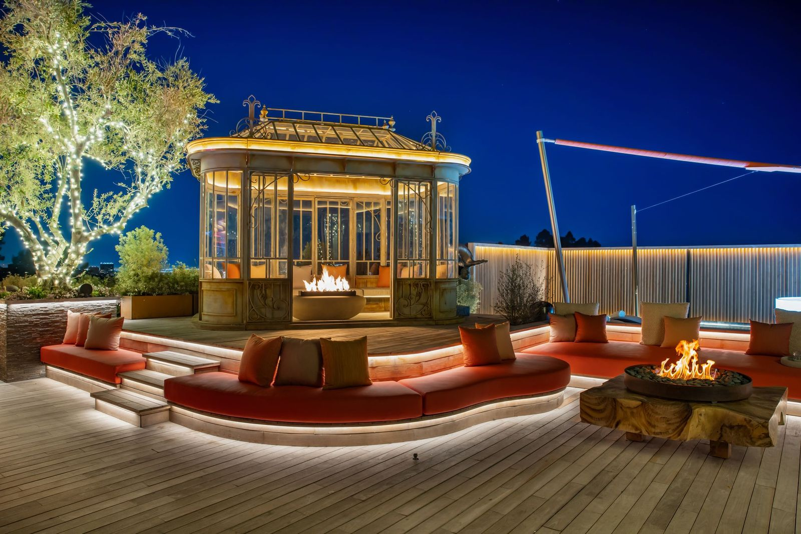 A separate glass-walled sauna pod adds another wellness feature to the property.
