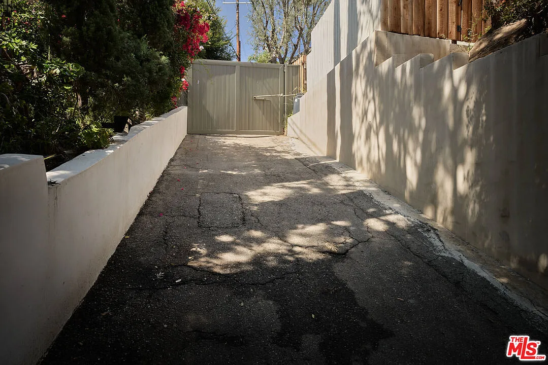 Private gate at the end of a driveway.