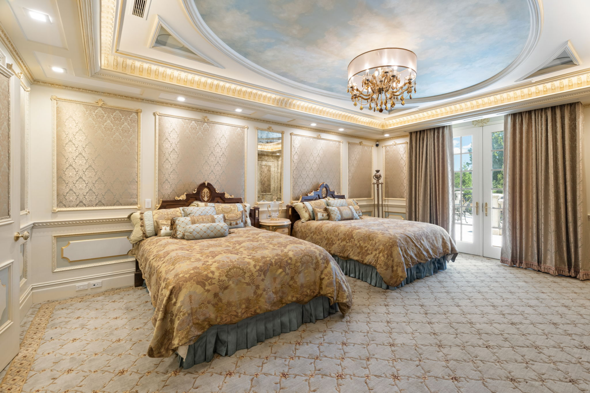 Detailed wall panels, layered molding, and a large oval ceiling treatment painted to resemble the sky add lightness to the heavier textiles.