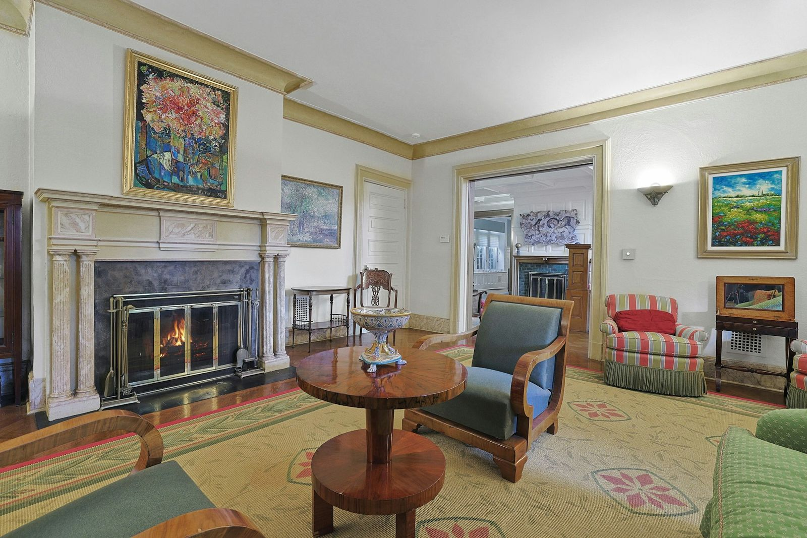Formal living room with a marble fireplace.