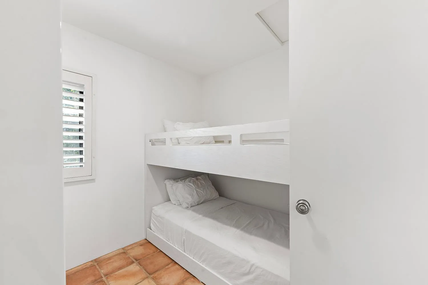 Small room with bunk beds.