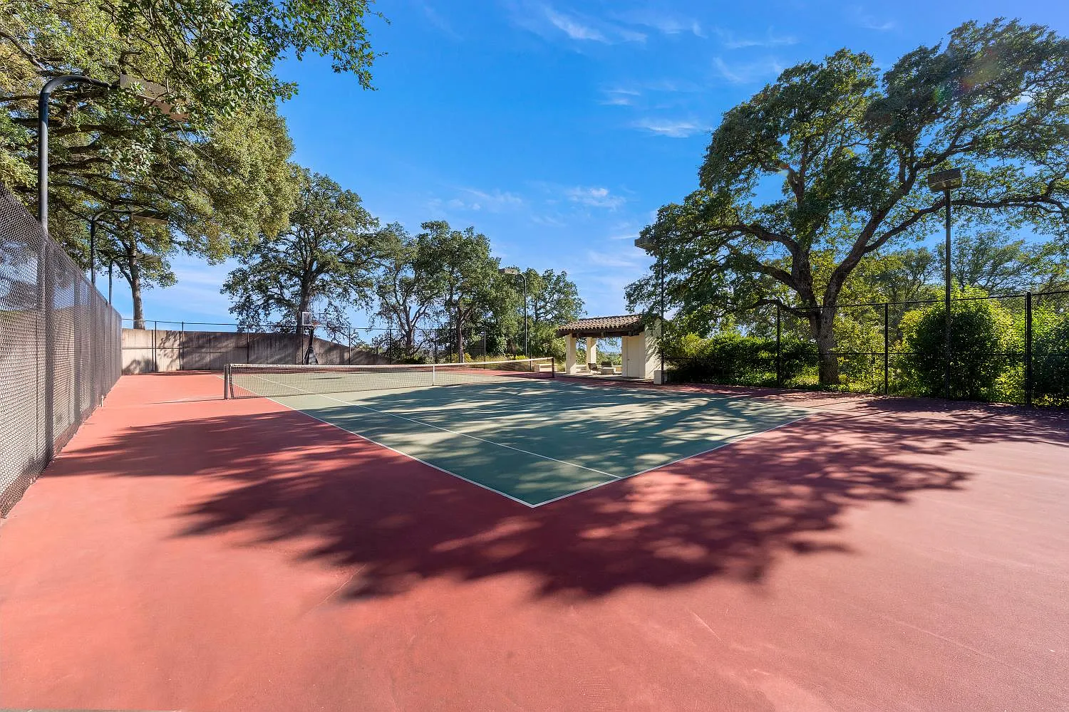 A full-size tennis court.