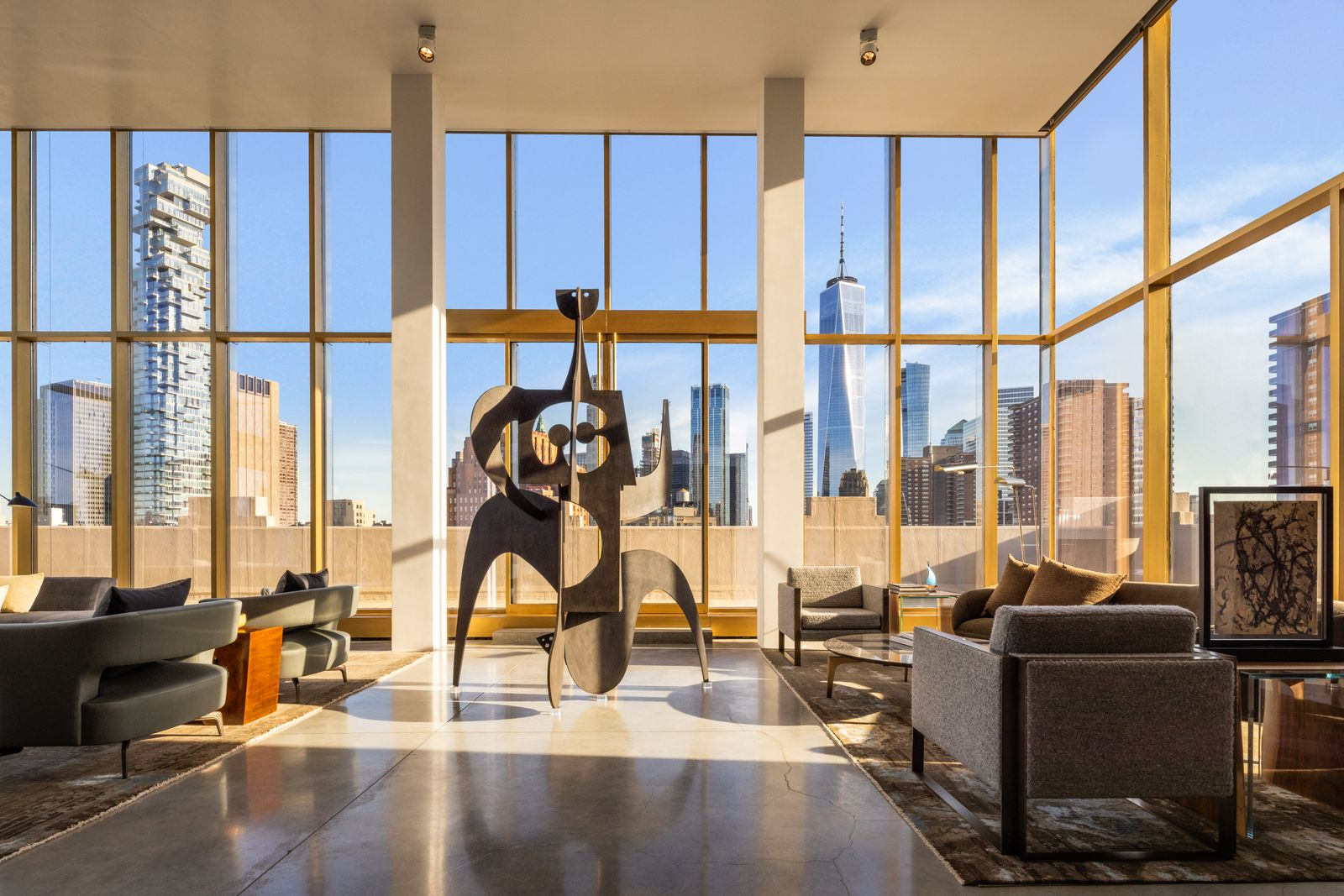 18-foot ceilings and floor-to-ceiling museum-quality glass frame uninterrupted views of One World Trade Center. 