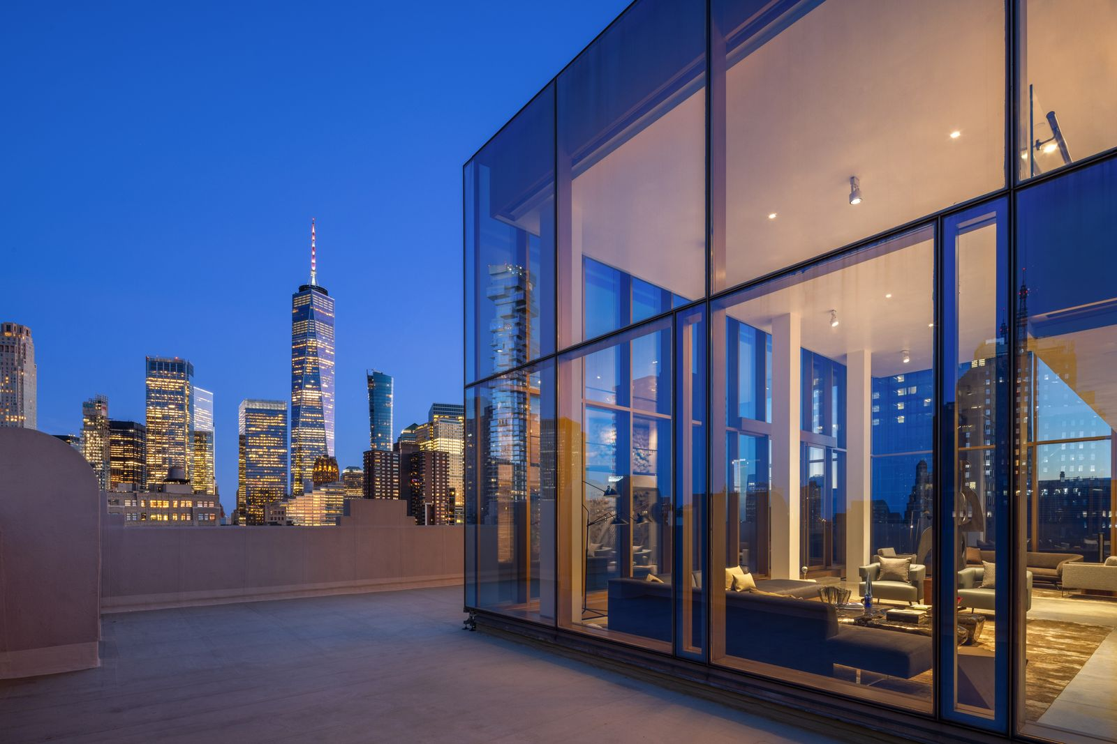 Wrapping around nearly every edge of the penthouse, the 4,500-square-foot terrace creates a continuous outdoor space around the glass exterior. 