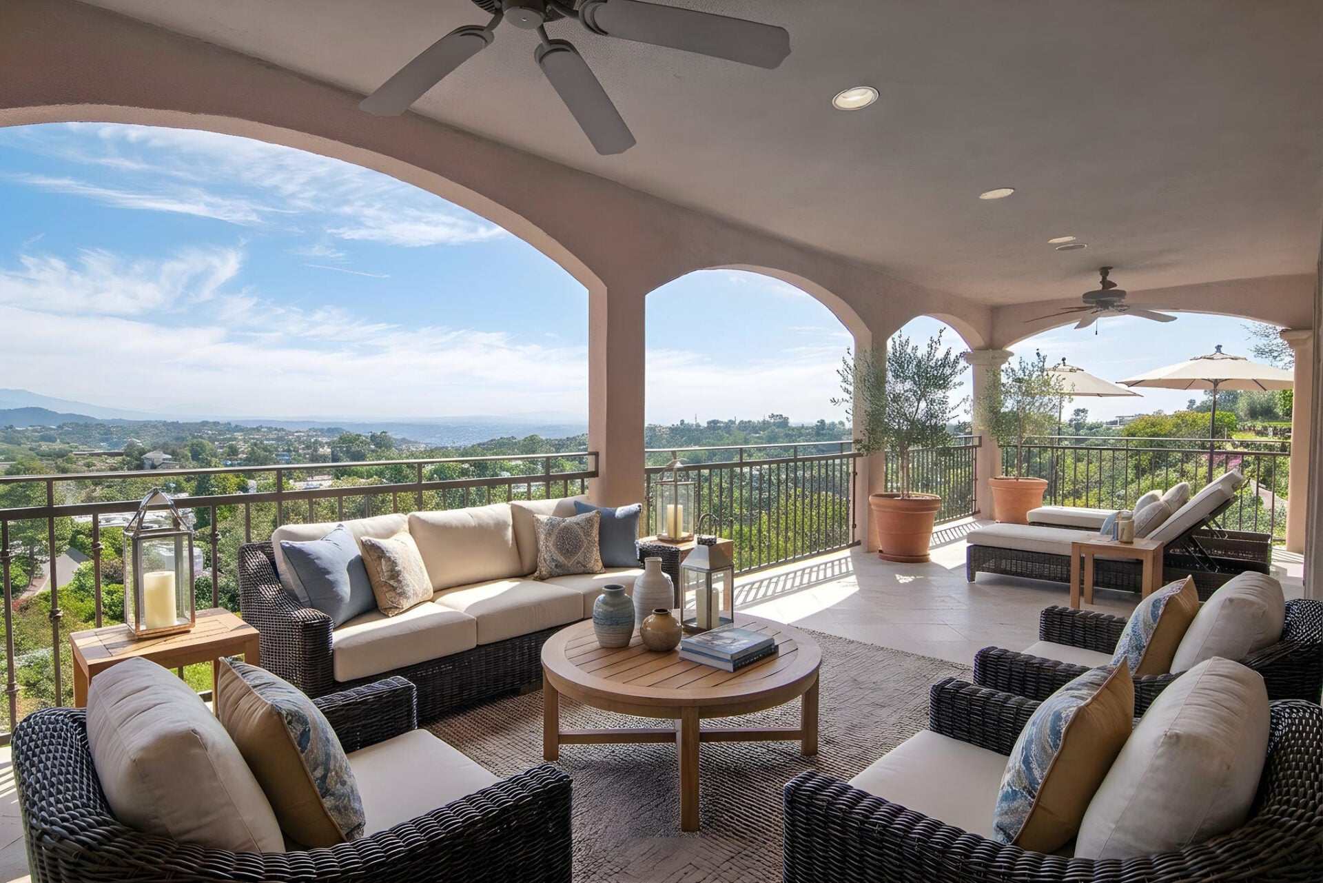 Large covered balcony with views of LA and the surrounding hills.
