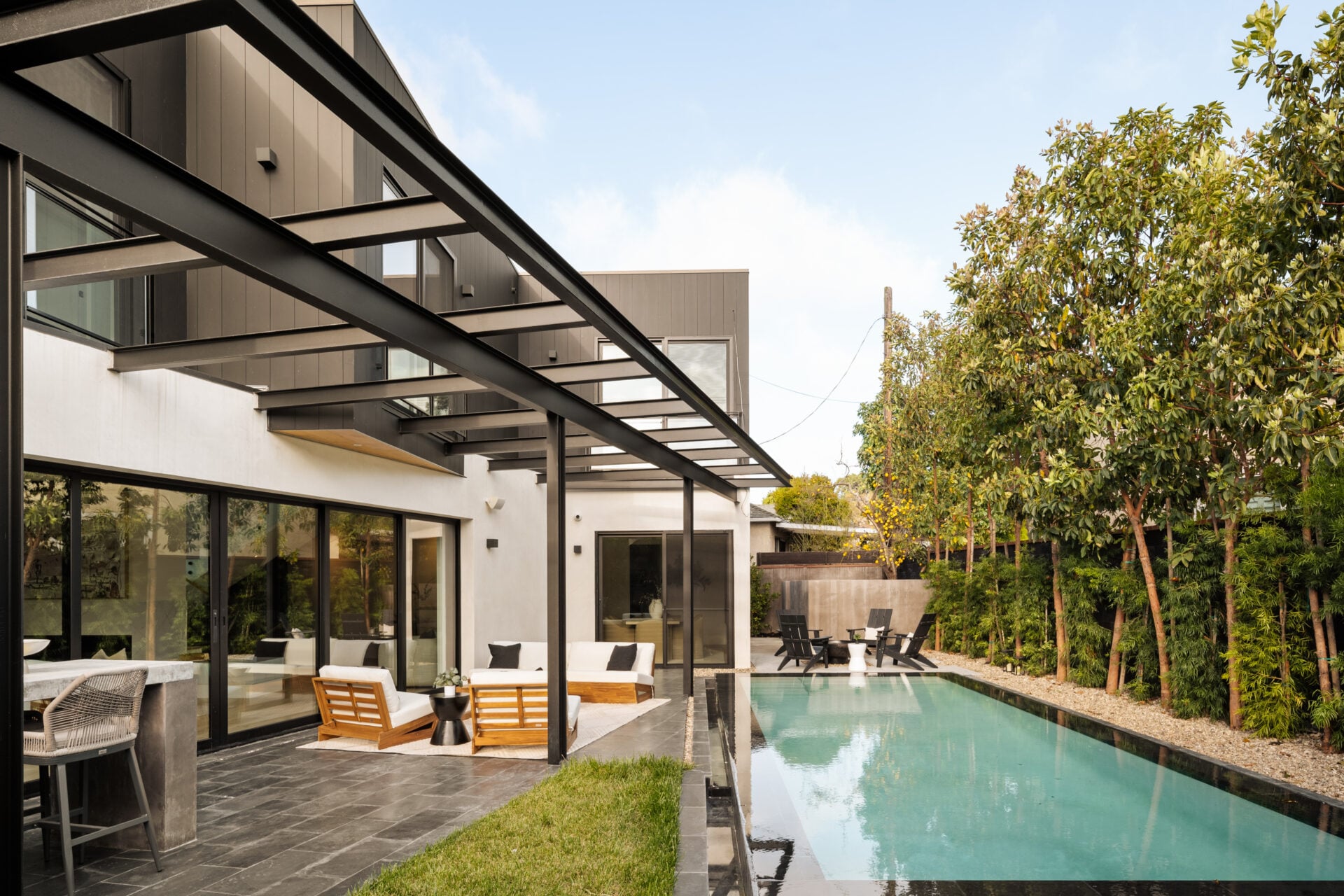 An infinity-edge swimming pool with an integrated jetted spa positioned at one end.