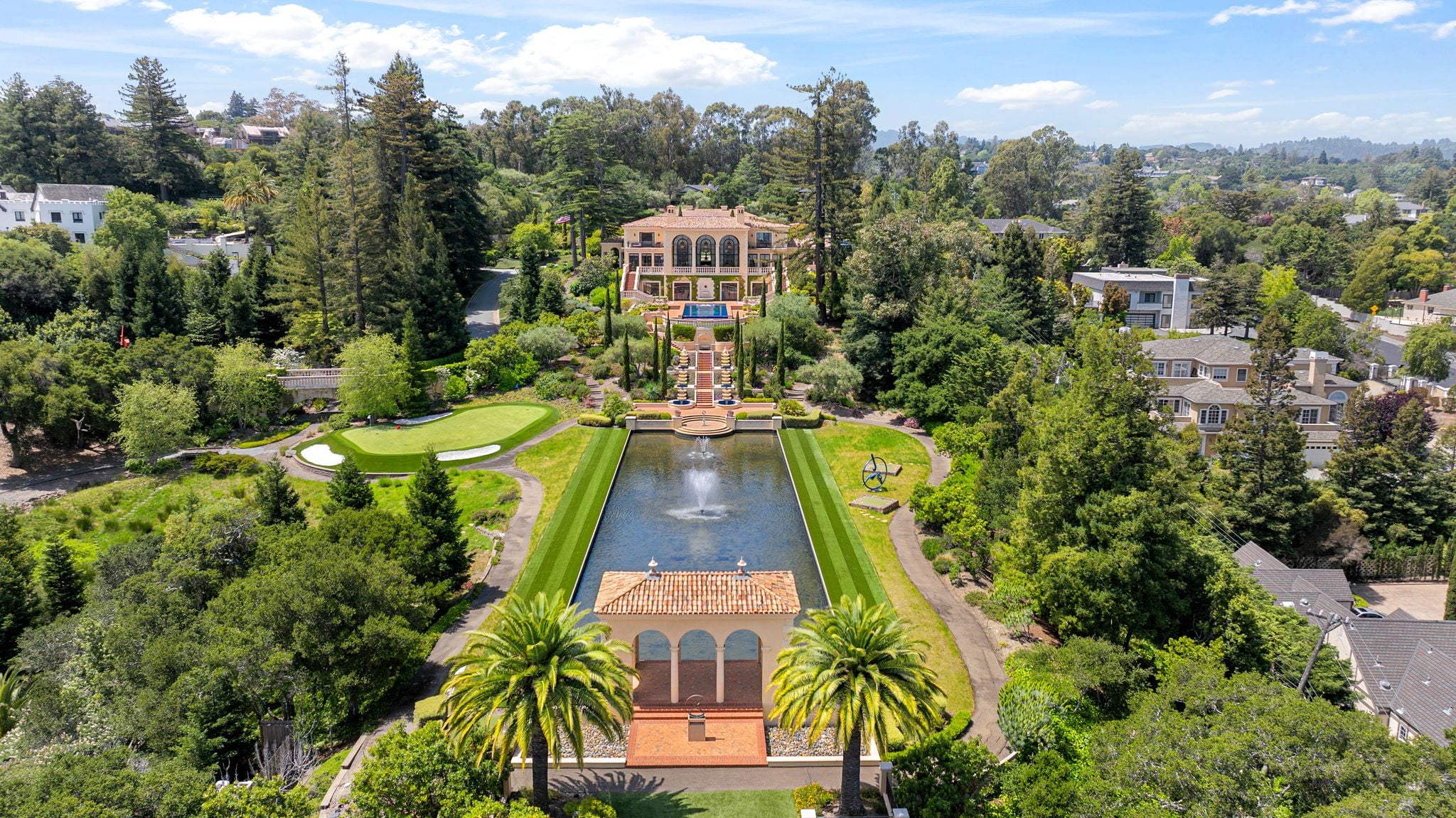 Silicon Valley Estate Inspired by Lake Como with a long reflection pond.