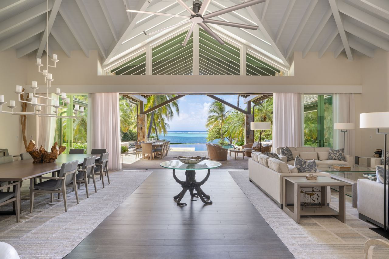 Along the beachfront side of the great room, one entire wall opens to the terrace.