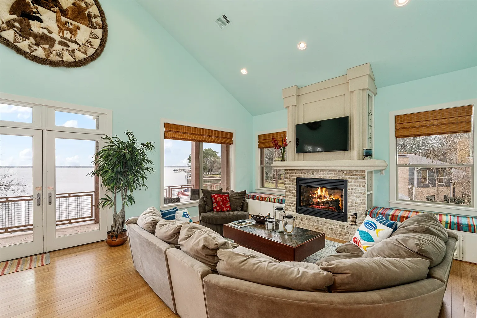 The second floor has its own living spaces, this time surrounded by light blue painted walls.