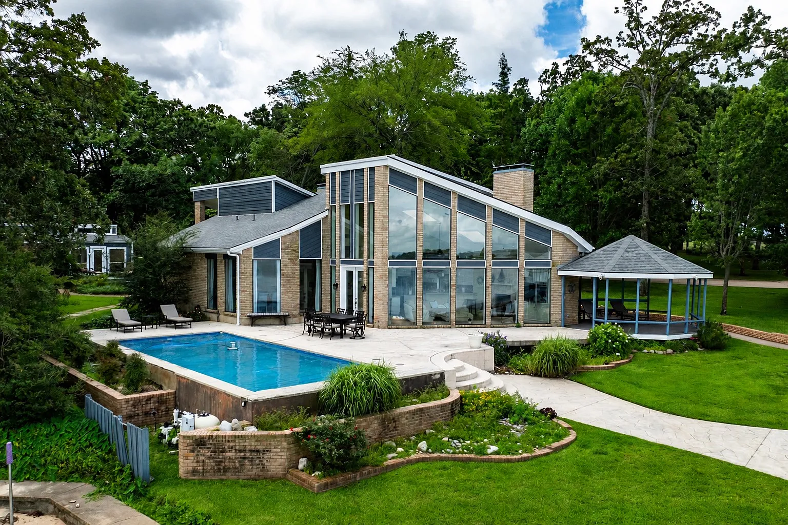 The property’s original A-frame residence sits along the pool terrace, adding another 2,389 square feet of living space. 