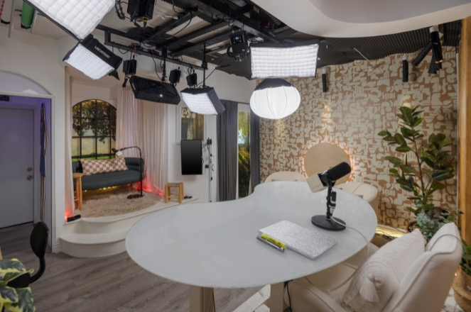 Podcast studio with overhead studio lighting.