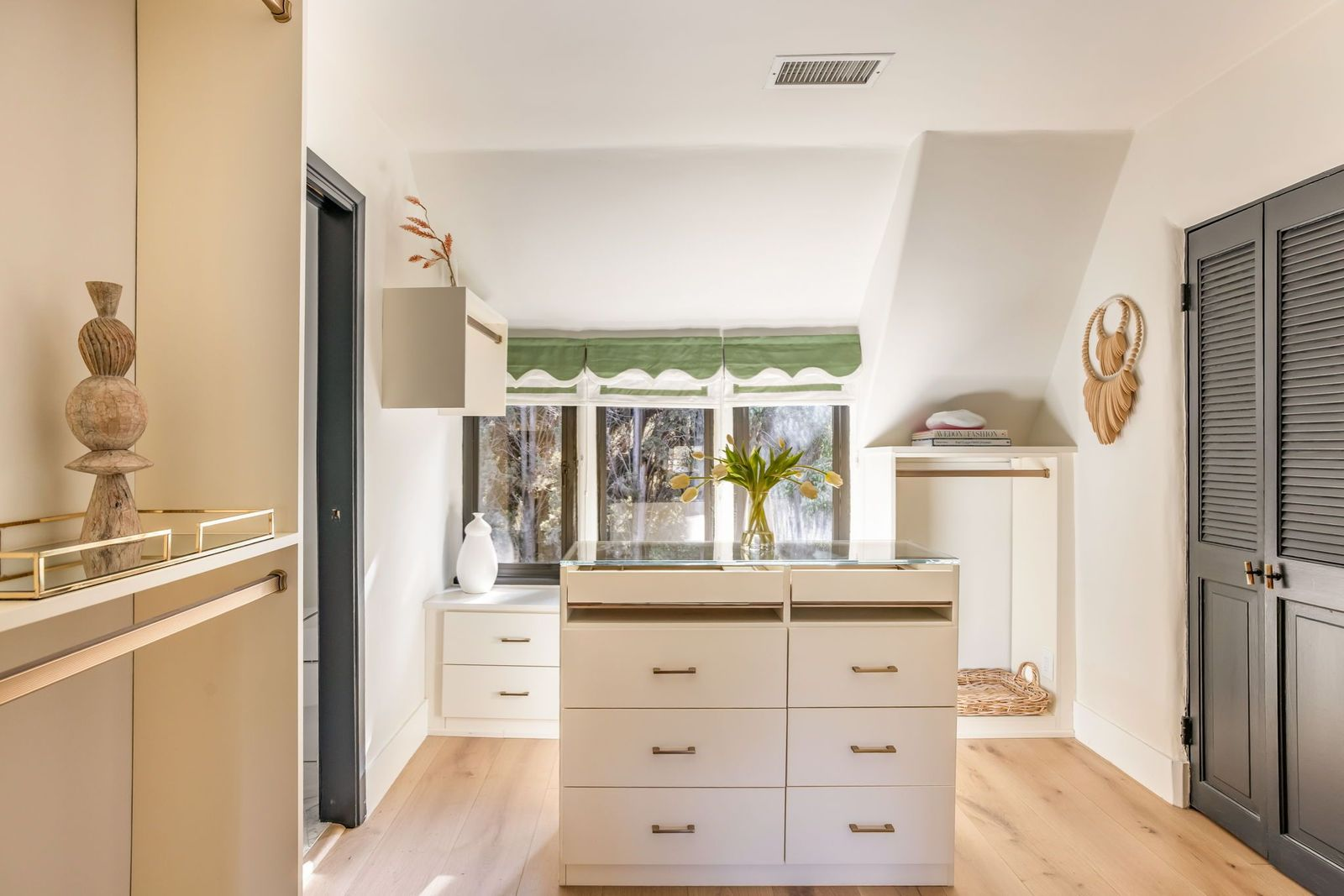 Walk-in closet with a lot of sunlight.