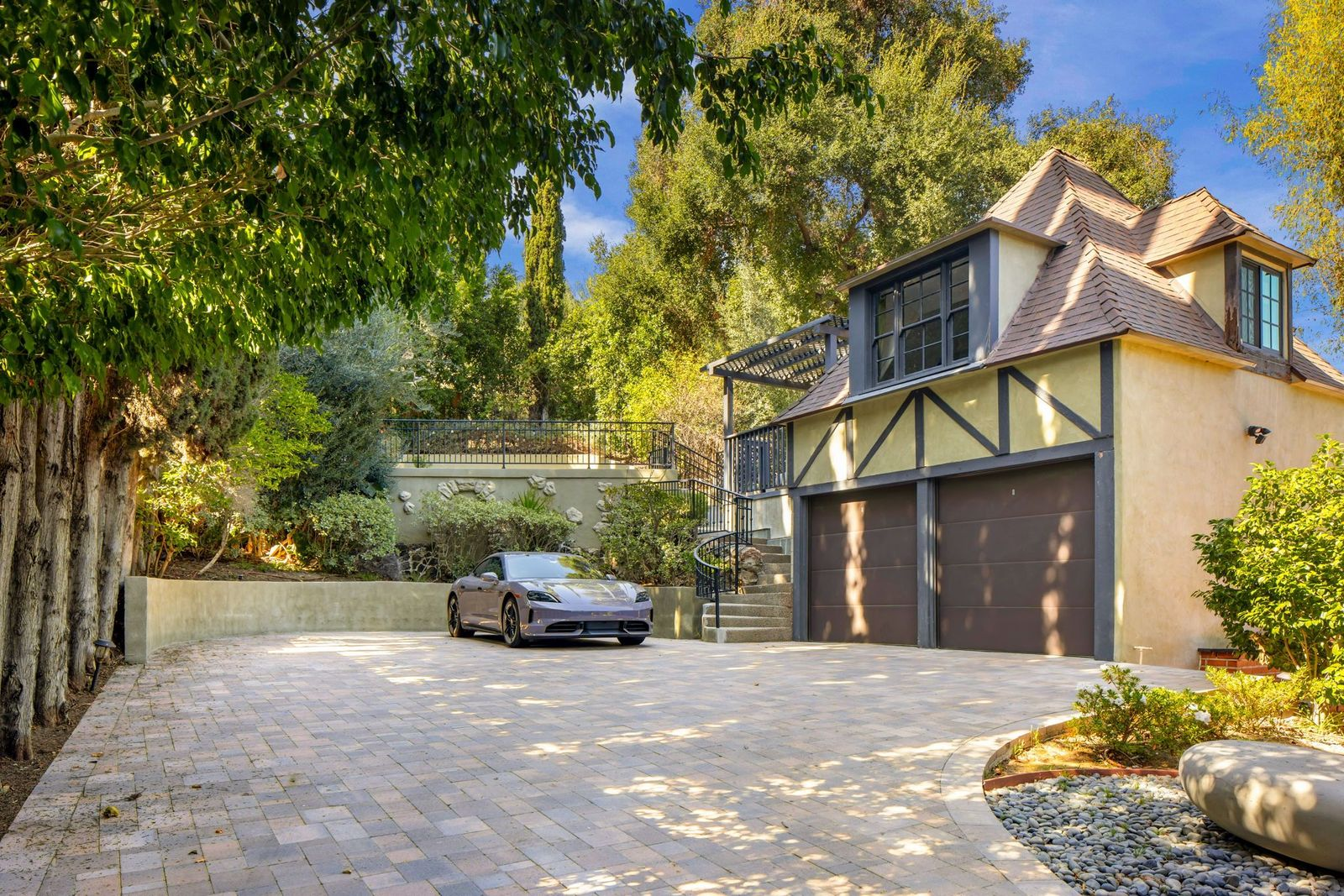 Set above the detached two-car garage is a guest house.
