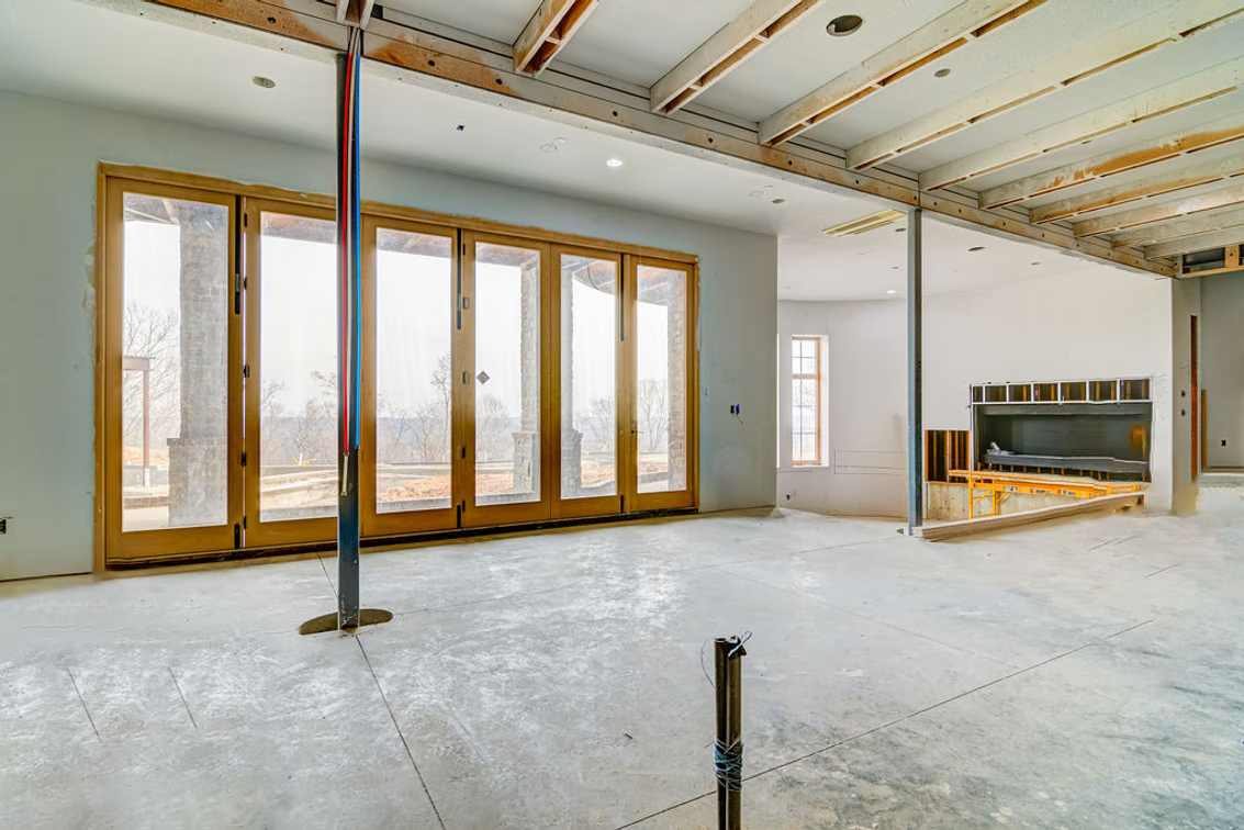 Unfinished basement adds another level of living and entertaining space, with tall French doors opening to the outdoors.