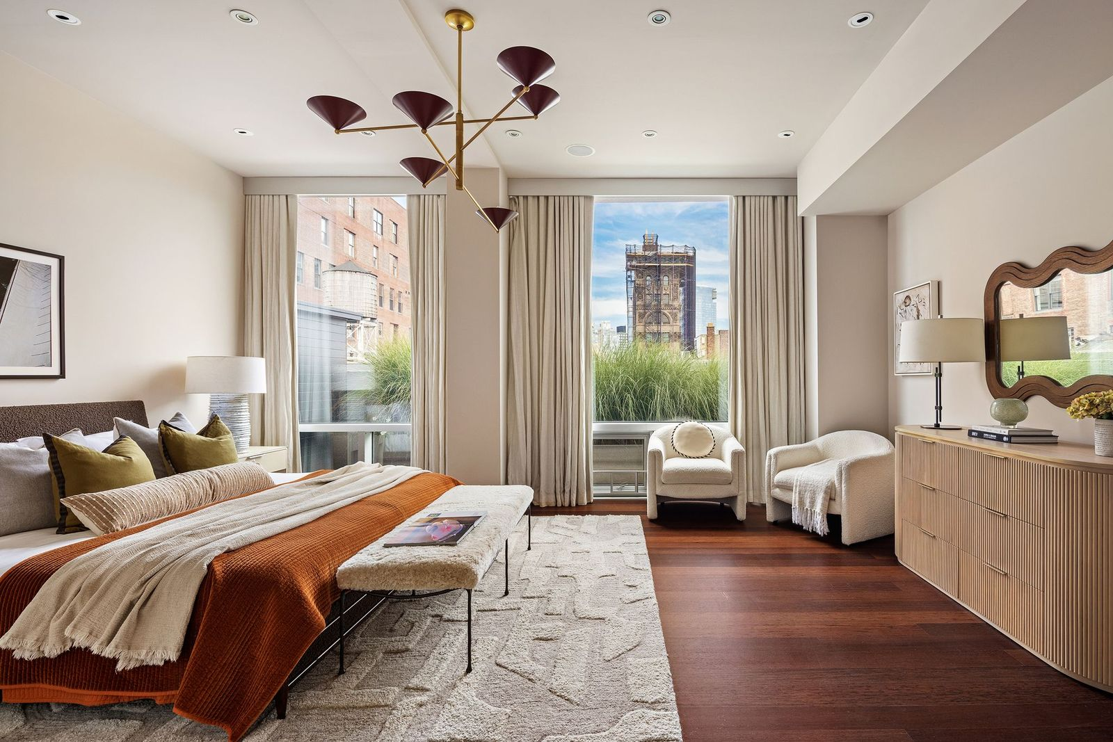 A second king-size en-suite bedroom looking out across one side of the primary's terrace.