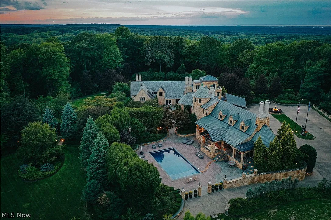 The property moves into wooded acreage, where trails wind through the trees and away from the main residence. 