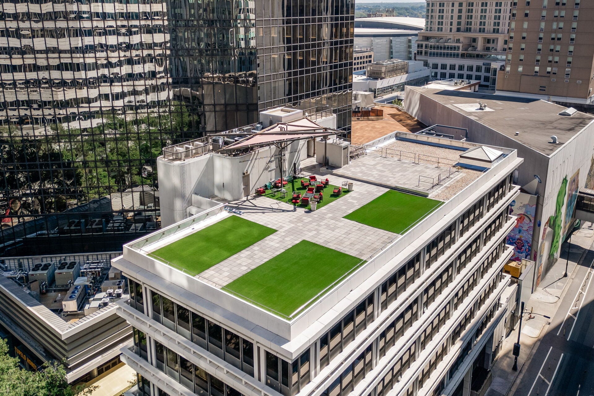 Expansive shared rooftop terrace overlooking the surrounding skyline.