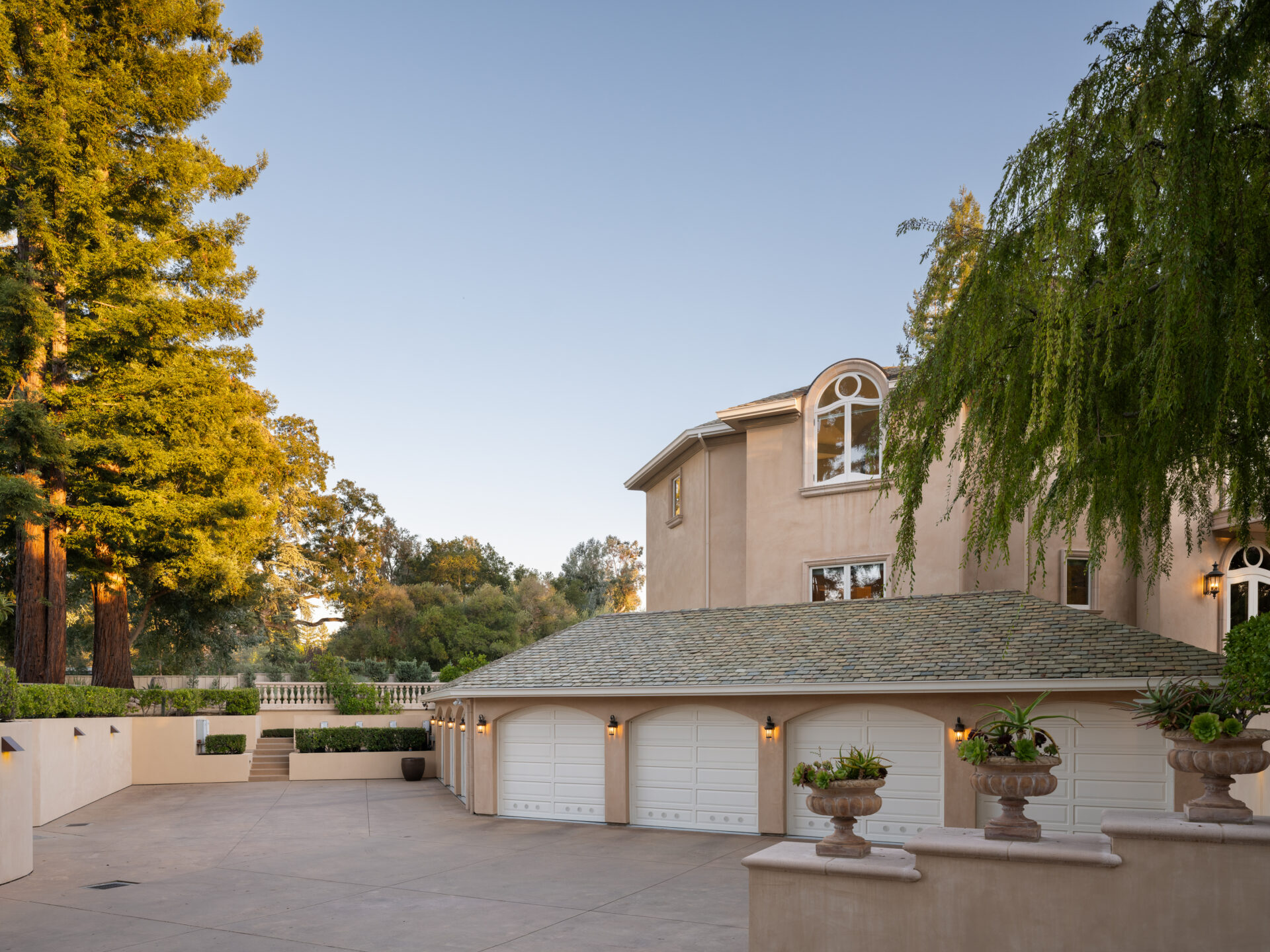A lower motor court tucked beneath the house with an underground seven-car garage.