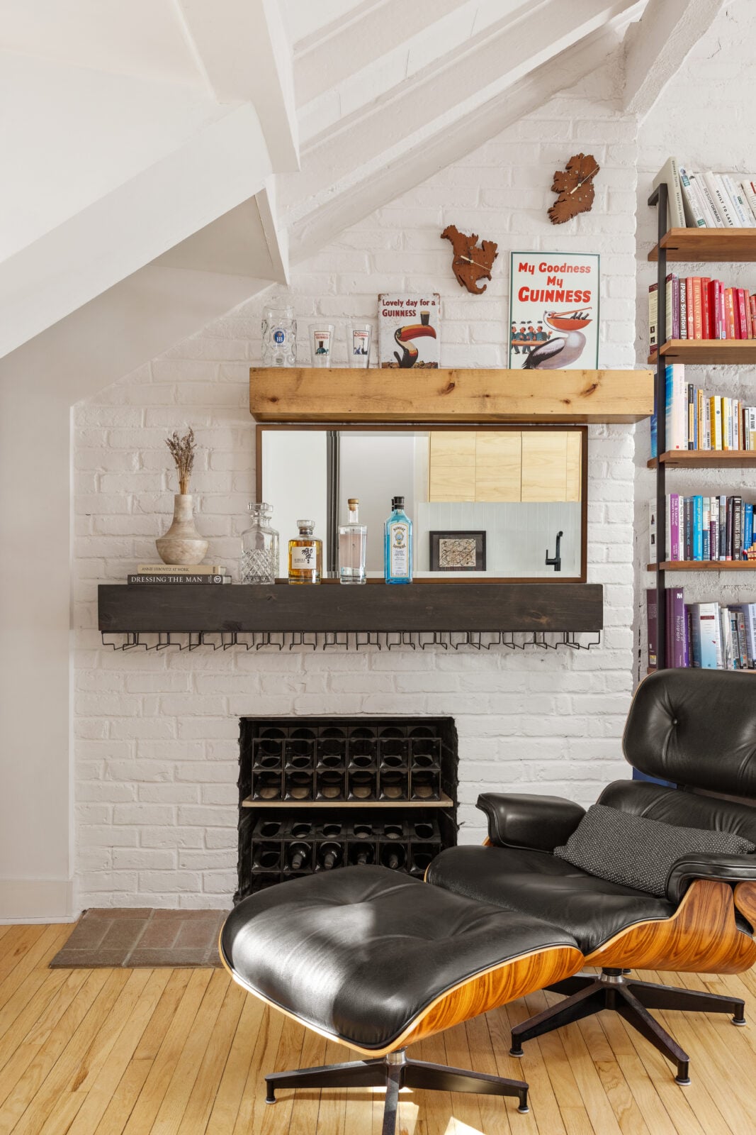 A working fireplace is built into the original brickwork, one of several historic elements preserved throughout the home.
