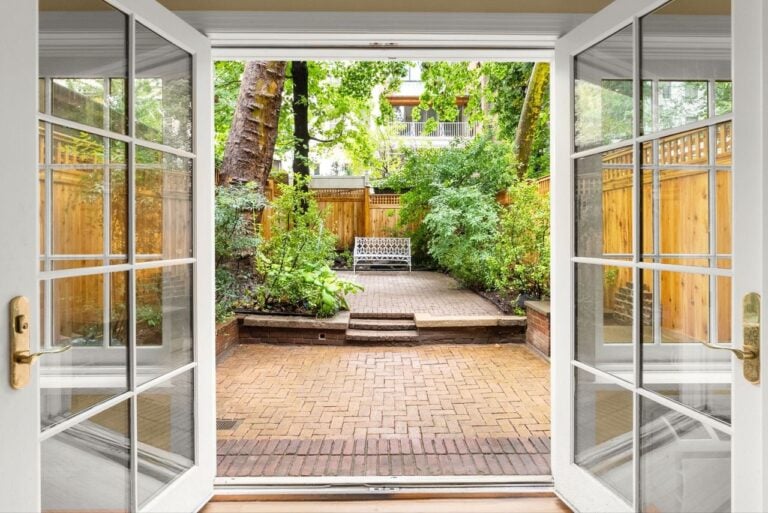 Glass doors opening to private terrace.
