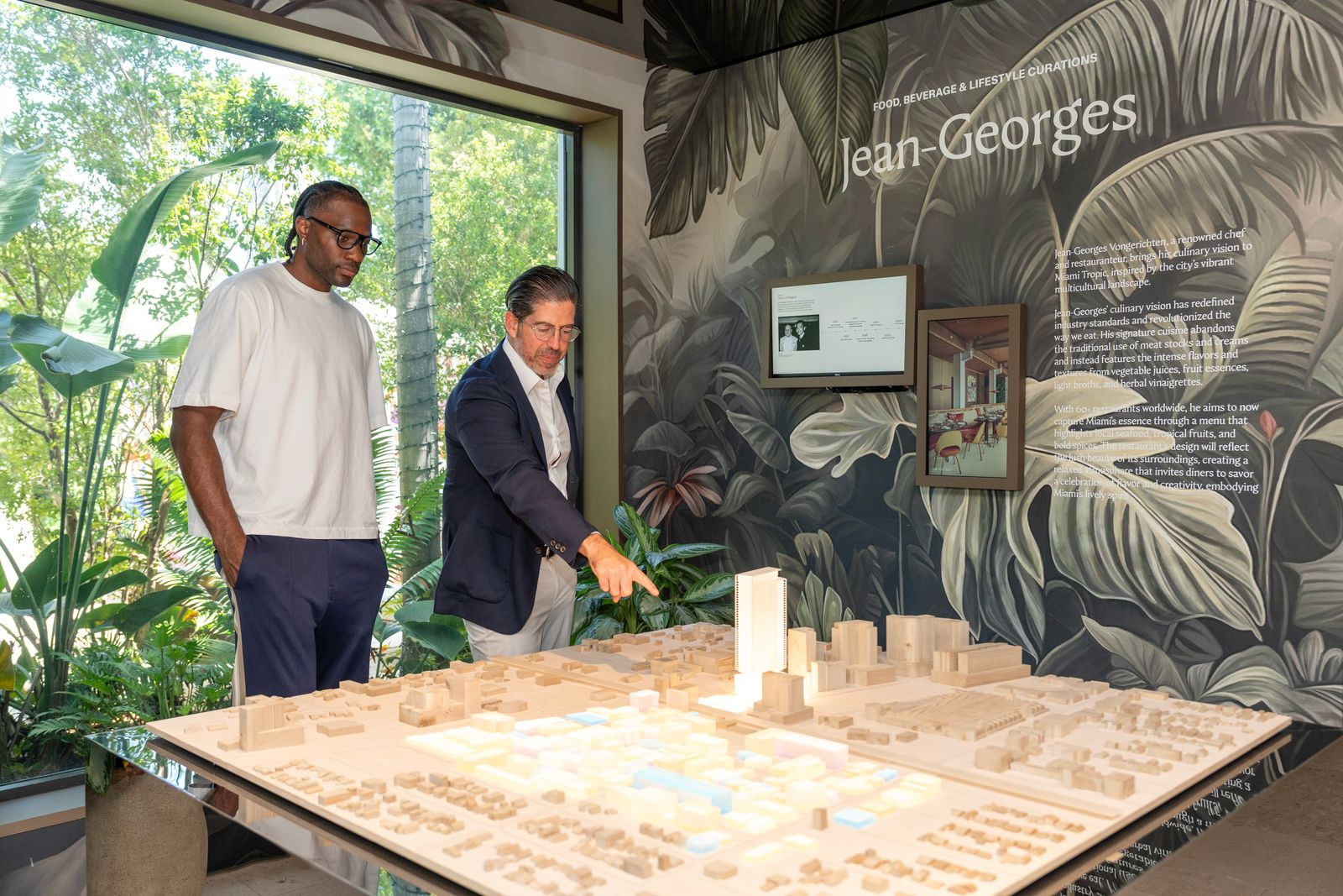 Precious Achiuwa looking at model of Jean-Georges Miami Tropic Residences.