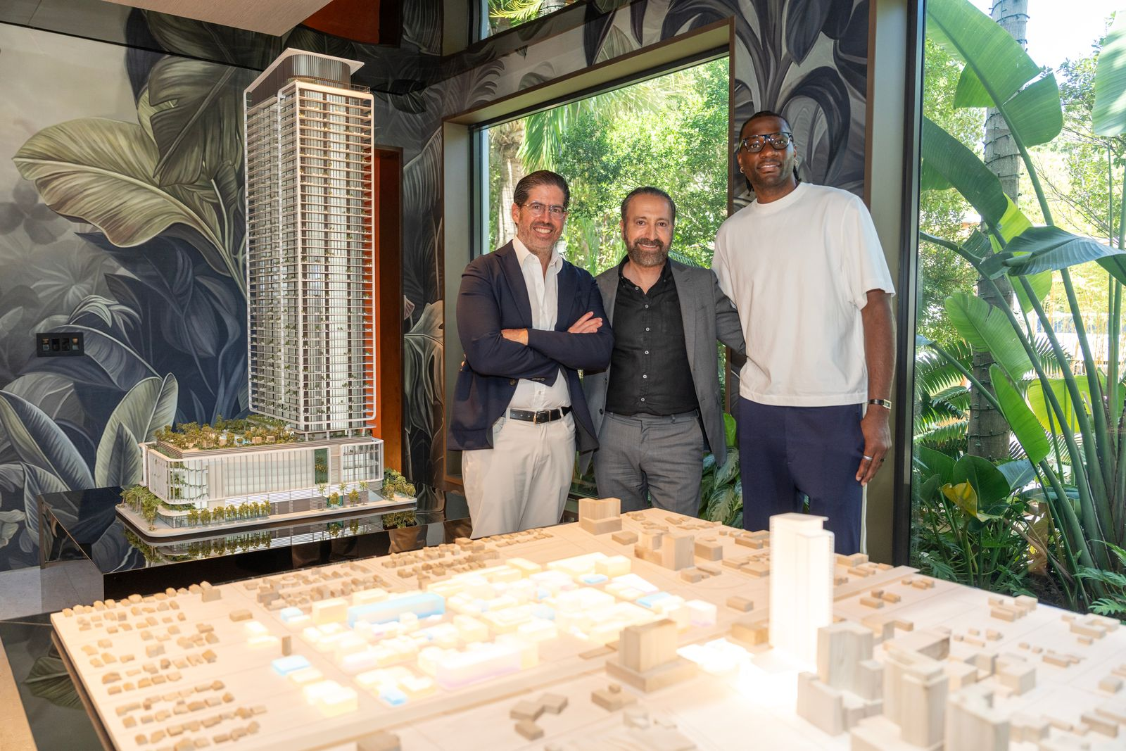 Precious Achiuwa posing with realtors after purchasing condo.
