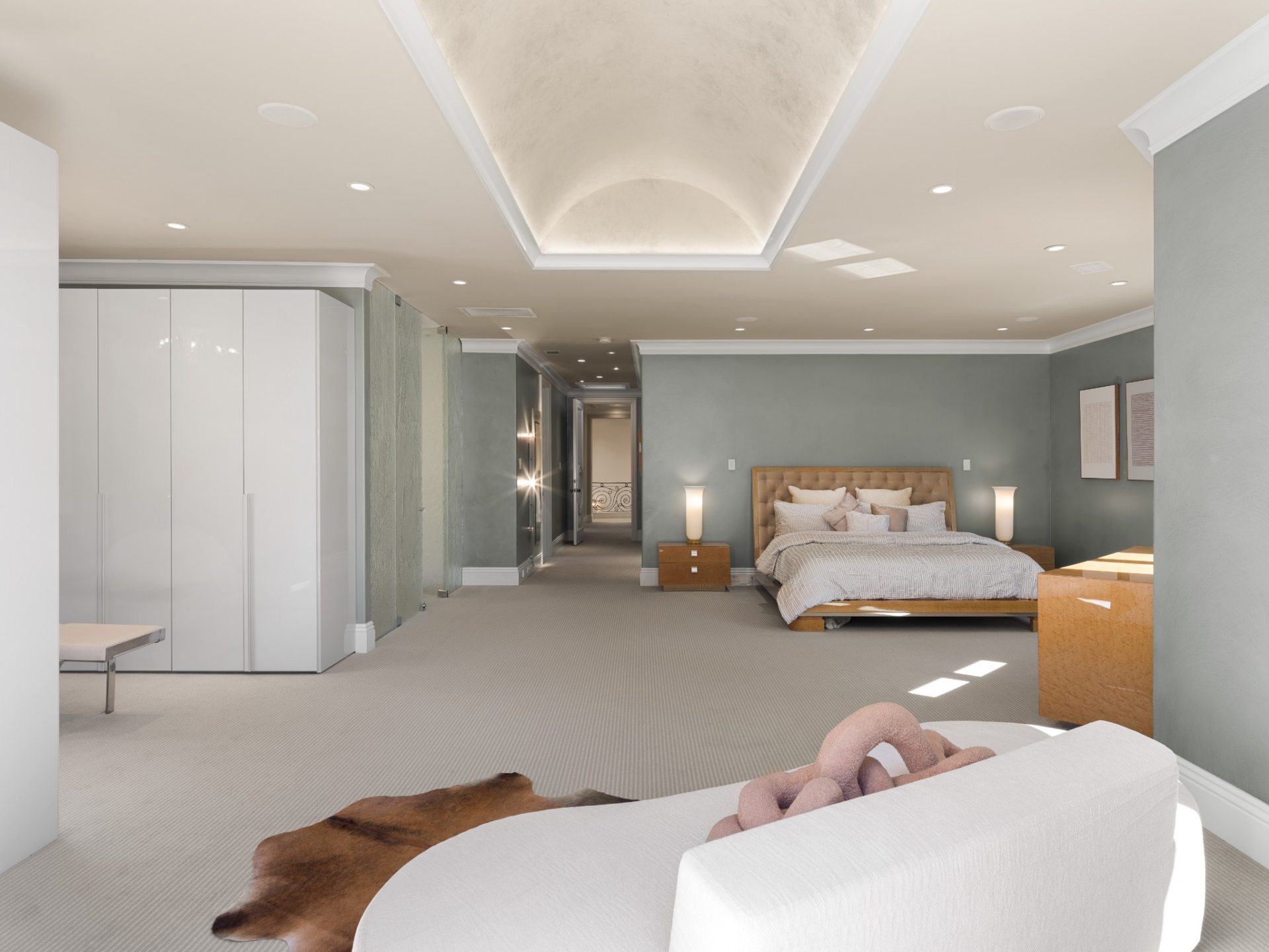 The secondary suite is set up with an open floor plan so that bedroom can fit the sleeping area, lounge, and closet all within the same space.