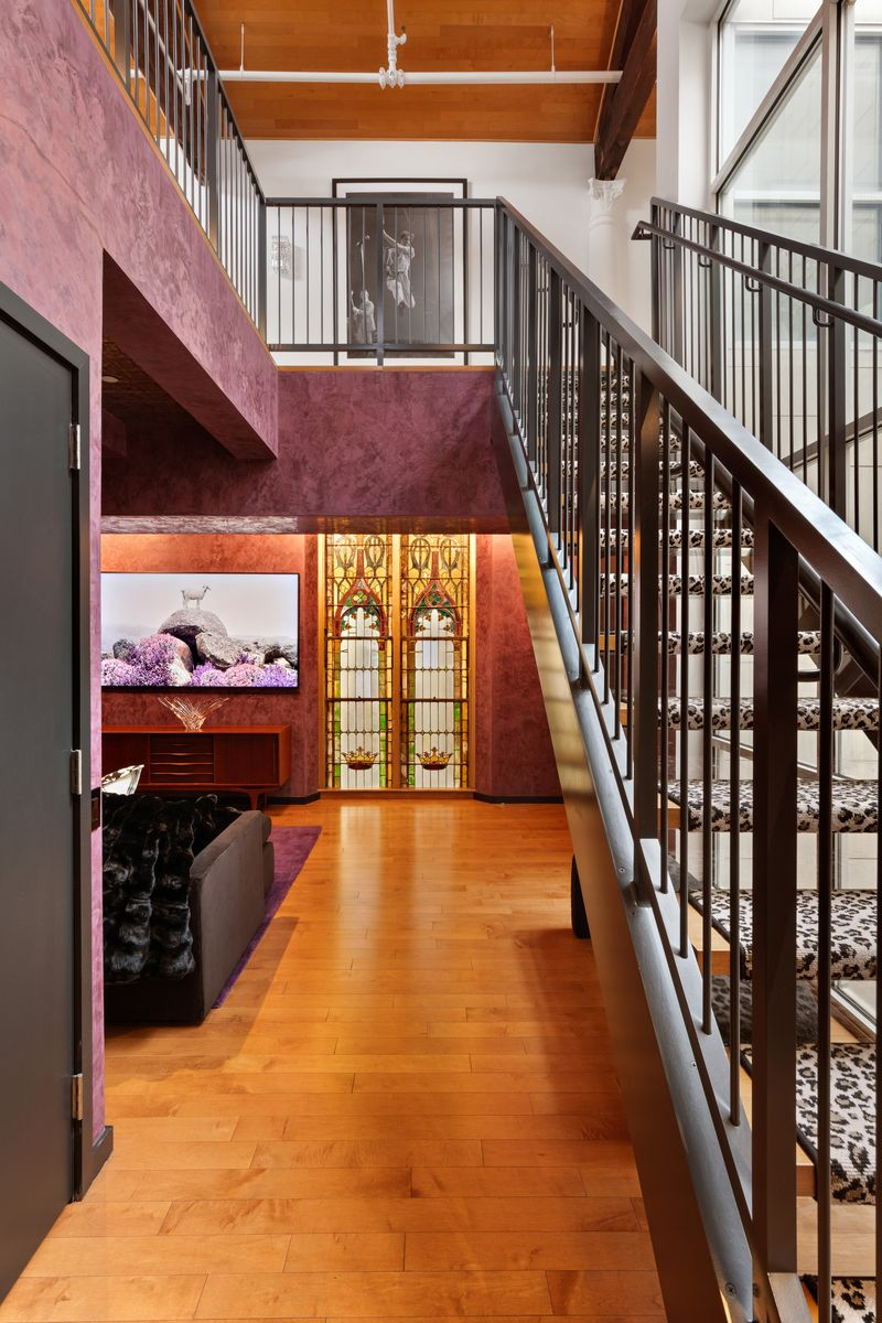 Lower level entrance to Steven Van Zandt's penthouse down leopard print stairs.