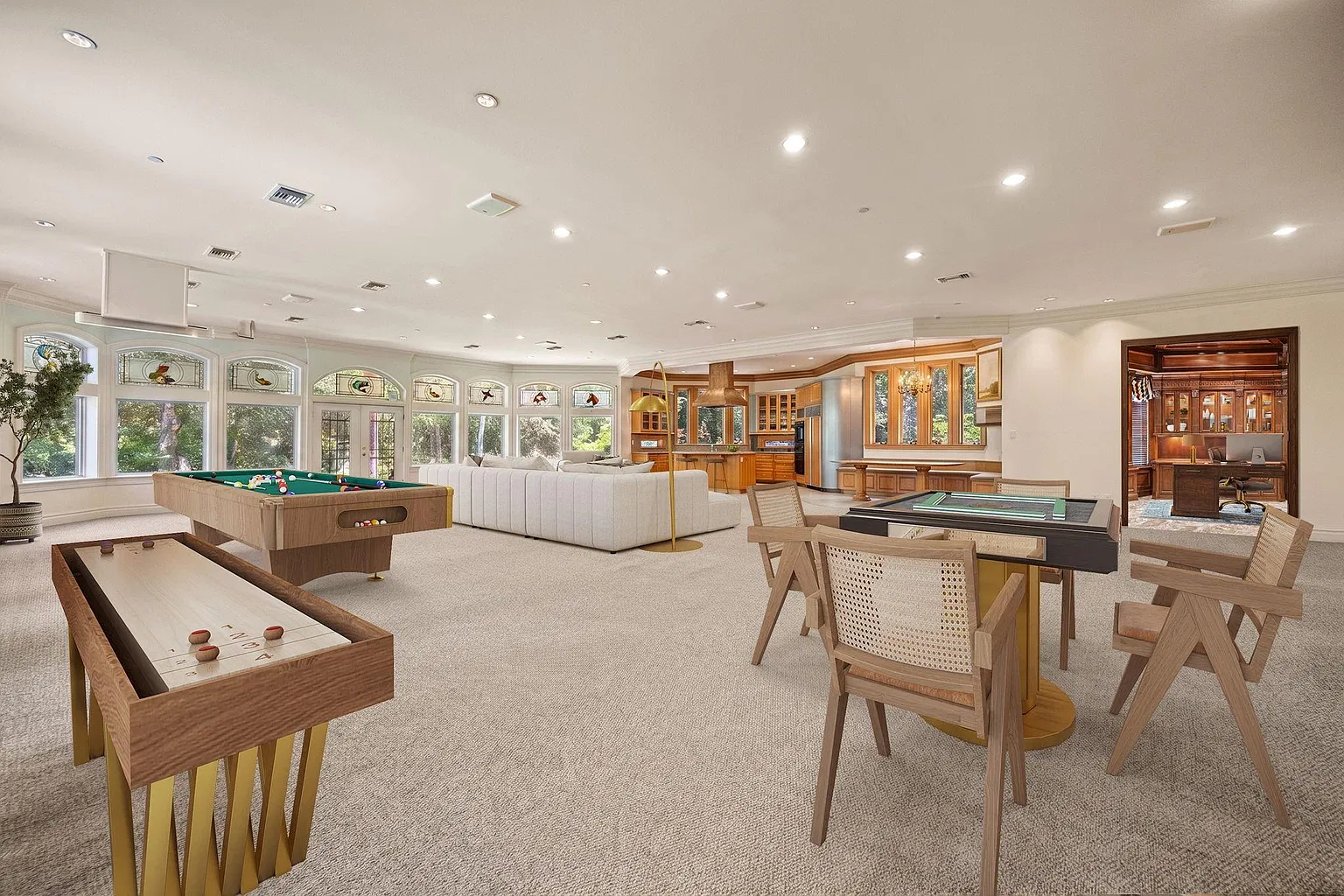 Entertainment room with a billiards table, shuffleboard, card table, and lounge area spread across the room.