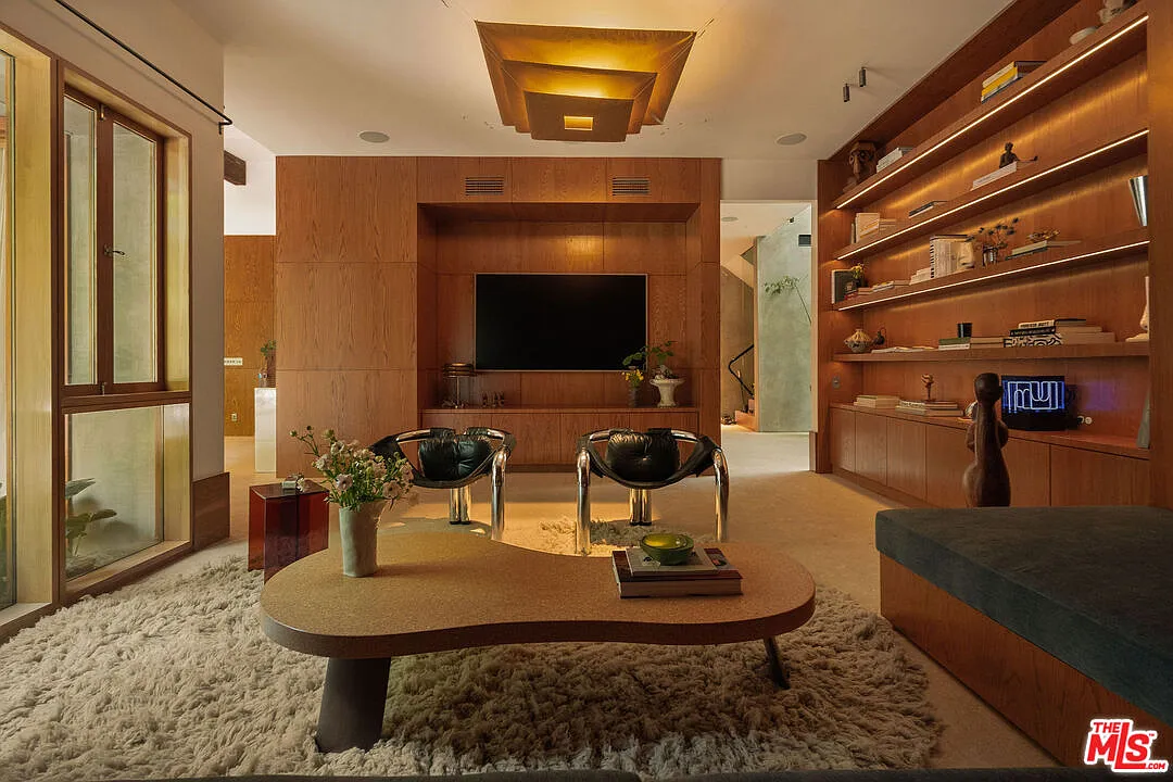 A screening room doubles as a library in one corner of the house.