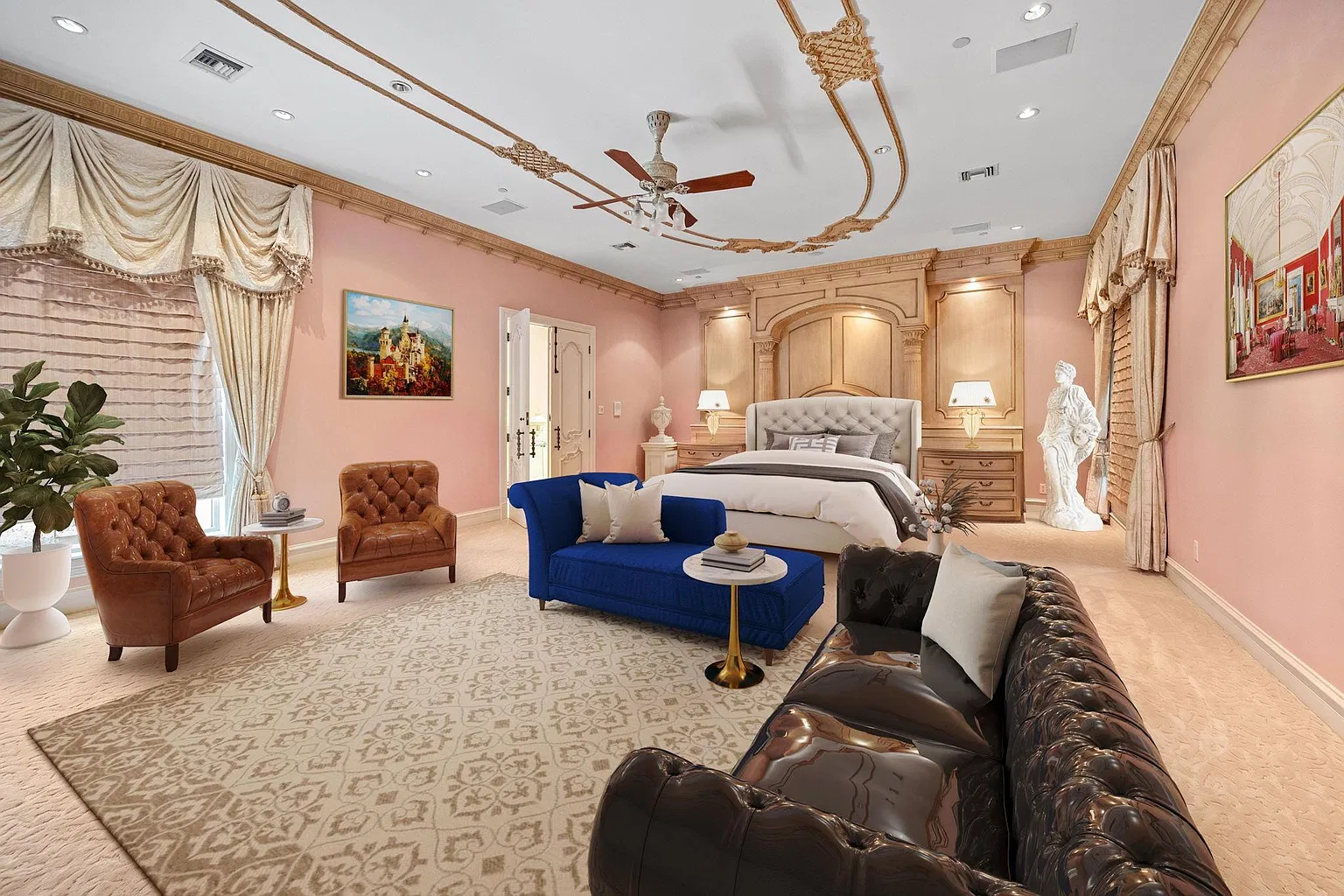 The primary suite opens to a spacious bedroom with the bed set against a paneled wall with built-in nightstands and gold-accented trim.