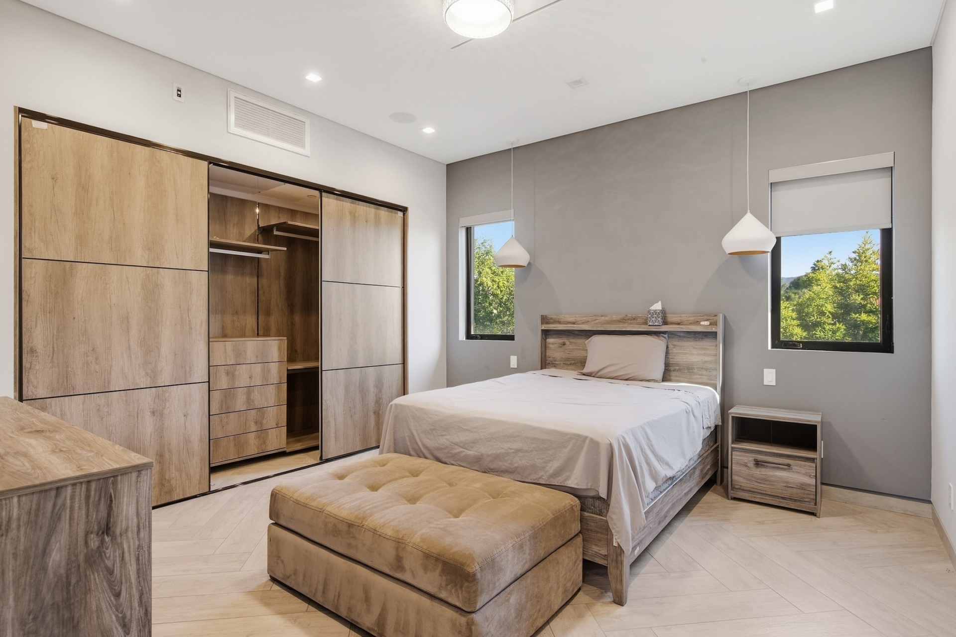 The guesthouse includes a private bedroom with built-in storage.