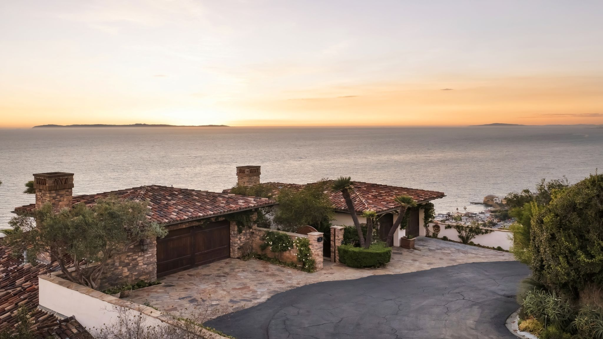 Home with traditional Santa Barbara architecture overlooking the ocean.