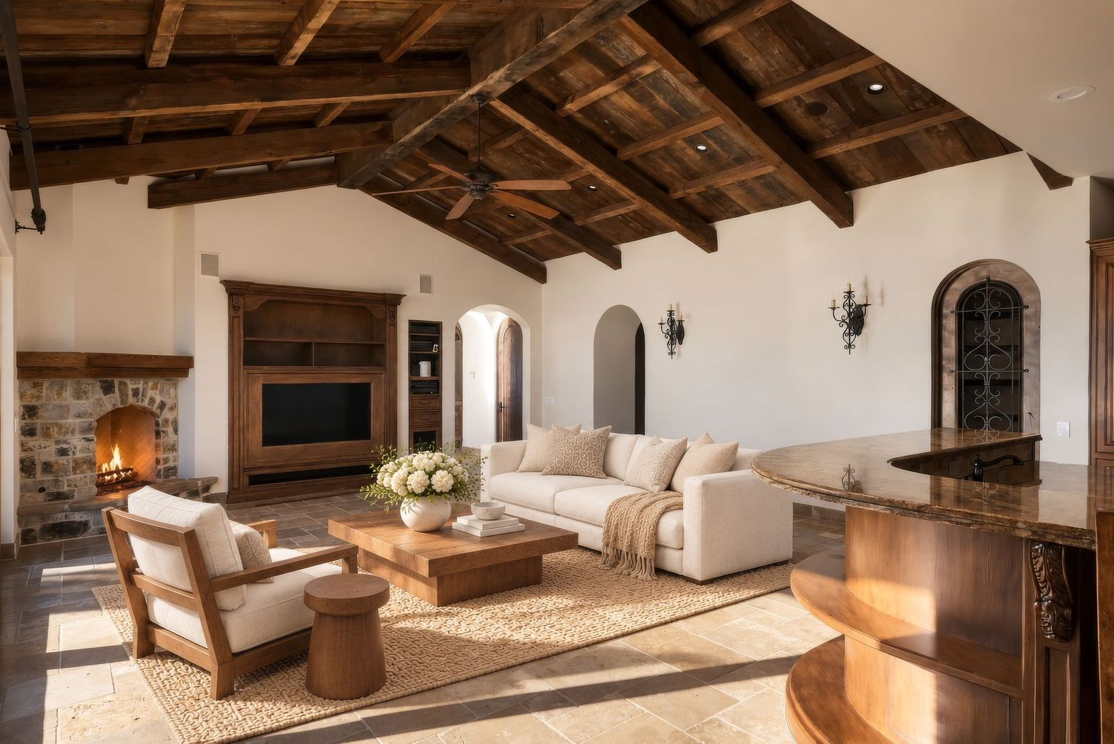 The lounge gathers between another stone fireplace and a built-in media wall.