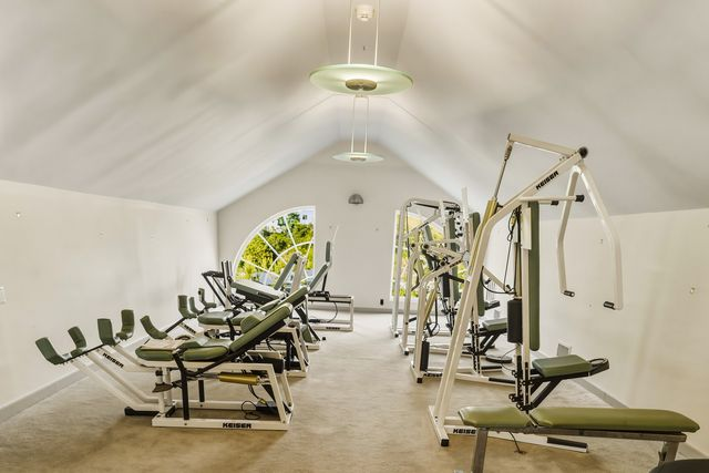 The entire top floor of the suite is used as a private gym and features multiple Keiser machines.