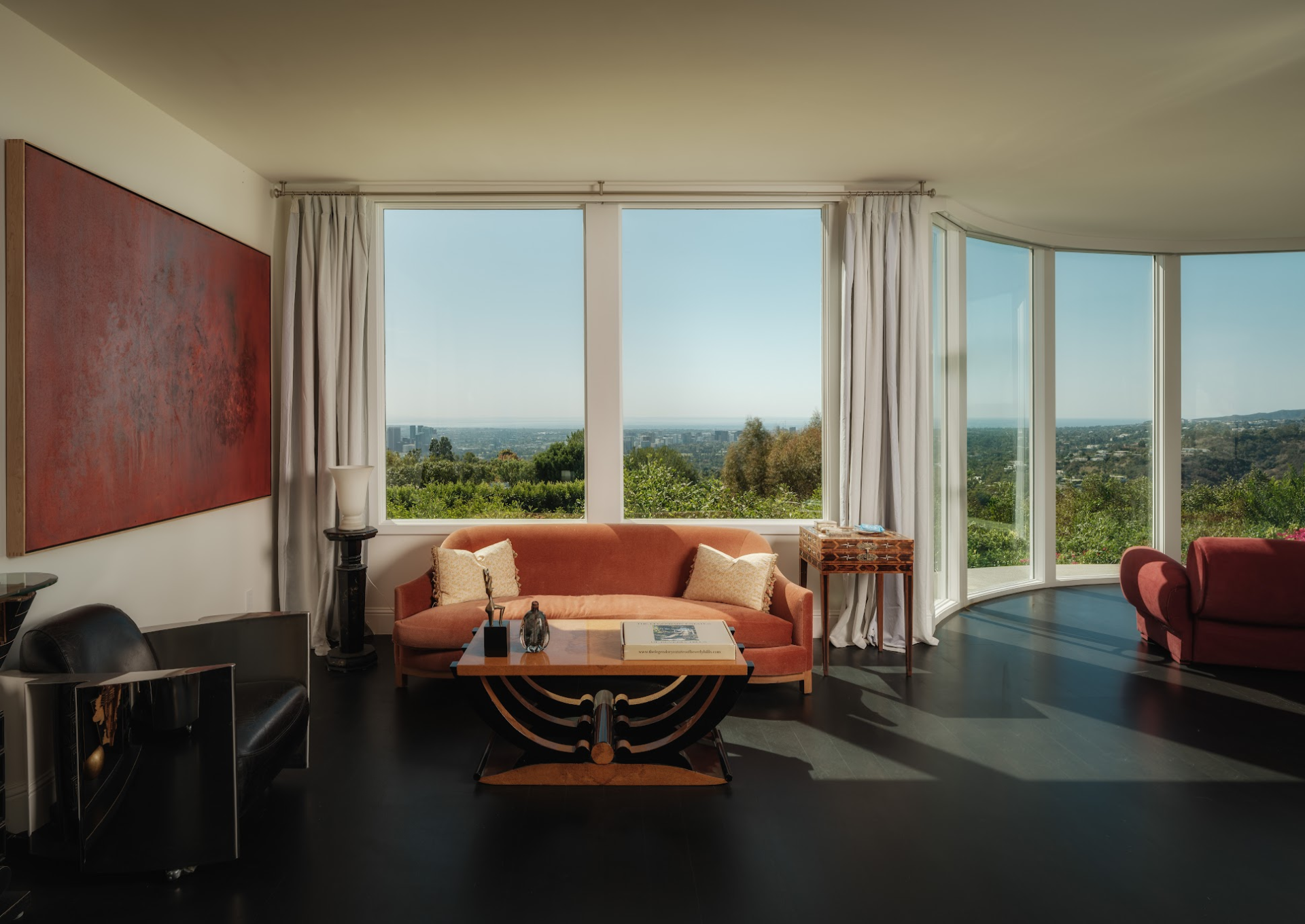 An expansive great room lined with glass for views of LA and the ocean.